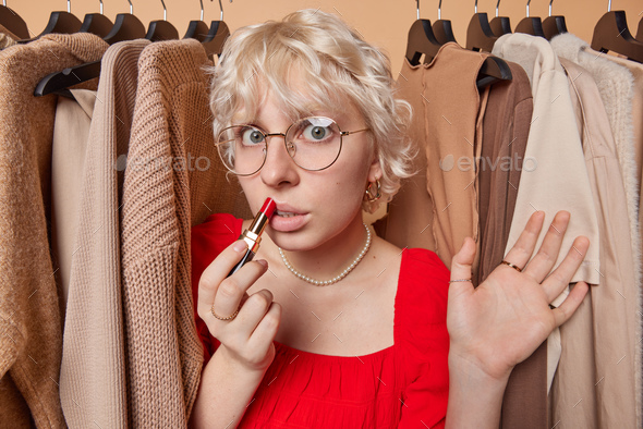 Photo Of Surprised Blonde Woman Wears Red Dress And Transparent