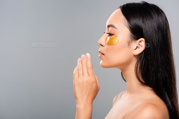 Side View Of Brunette Naked Asian Woman With Eye Patches On Face