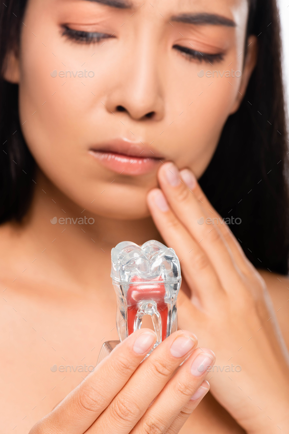 Selective Focus Of Sad Naked Woman With Toothache Holding Tooth Model