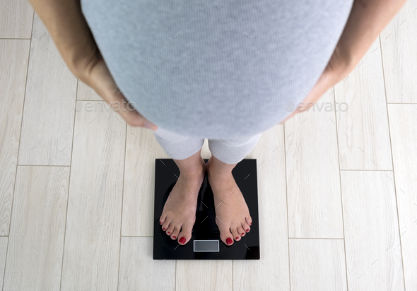 Pregnant Woman On Scales At Home Control Her Weight Gain Weight