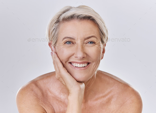 Portrait Of A Happy Smiling Mature Caucasian Woman Looking Positive And