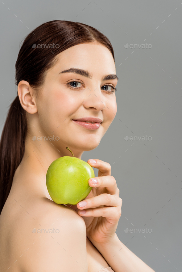 Brunette Nude Woman Holding Green Apple On Shoulder Isolated On Grey