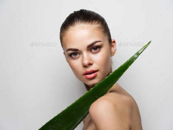 Nude Woman With Aloe Leaf On A Light Background Side View Stock Photo