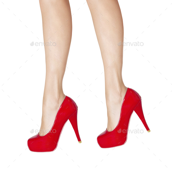 Female Legs Wearing High Heels Isolated On White Background Stock Photo