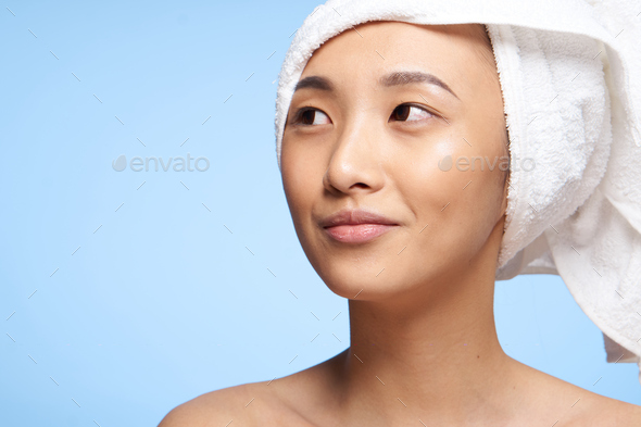 Asian Woman Naked Shoulders And A Towel On Her Head Close Up Stock