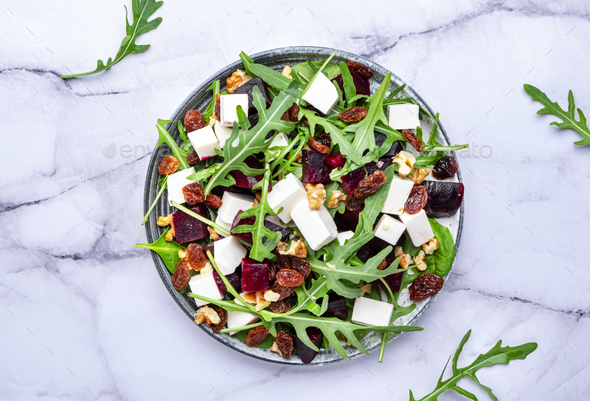 Sweet Beetroot Salad With Feta Cheese Fresh Arugula Raisins And Nuts