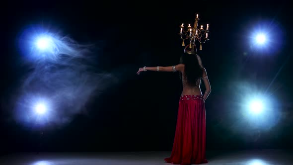 Attractive Belly Dancer Girl Go On Dancing With Candles Her Head