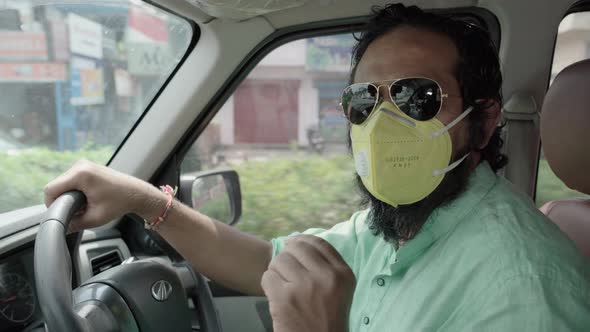 Indian Man Driving During Coronavirus Pandemic Removing His Face Mask Talking