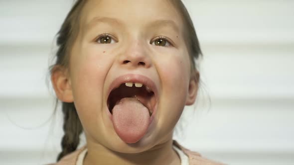 Girl of 78 Years Old Diligently Shows Her Tongue
