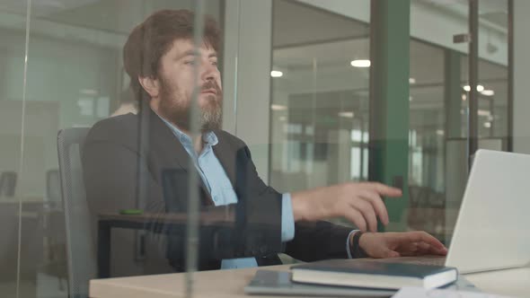 Caucasian Businessman Sharing Joy with Colleague alt