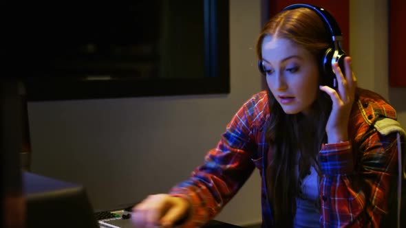 Female audio engineer using sound mixer alt