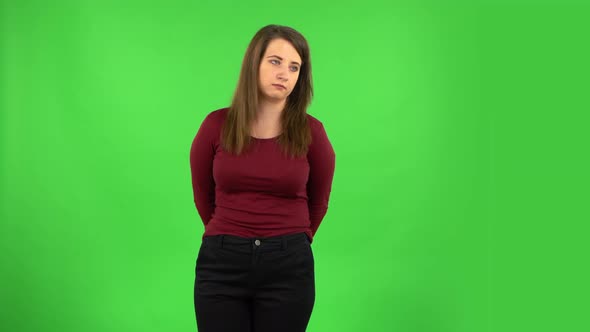 Pretty Girl Is Waiting and Yawning with Boredom. Green Screen alt