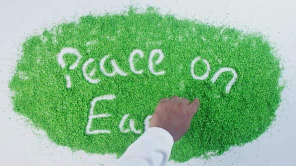 Indian Hand Writes On Green  Peace On Earth