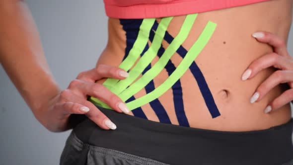 Kinesio Tape on Girl Belly alt