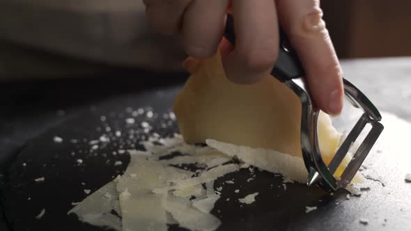 Parmesan Cheese Composition on a Wooden Cutting Board alt