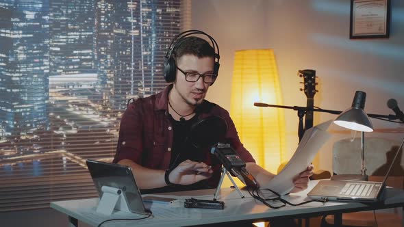 Home Recording Studio the Speaker in Headphone Reads the Story Into the Microphone alt