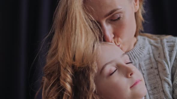 Mother and Daughter Cuddle Carefree alt