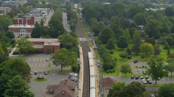 Aerial View of a Train Stopped at a Station in Garden City Long Island alt