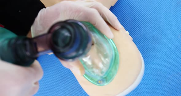 Male paramedic during cardiopulmonary resuscitation training alt