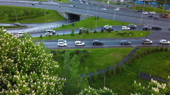 Aerial View of Loaded Cars in the Evening Hour During Sunset After Dojd Against a Background of