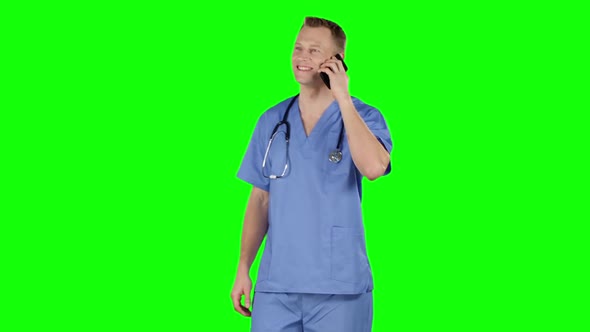 Doctor Having Call Using Cell Phone. Green Screen alt