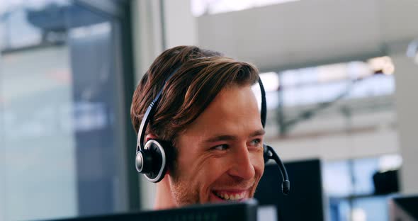 Customer service executive working in a call centre alt