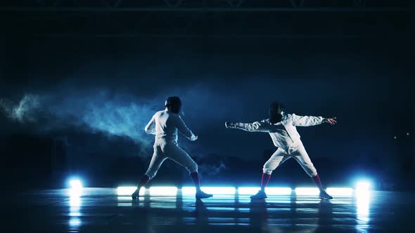 Athletes are Practicing Fencing in Slow Motion alt