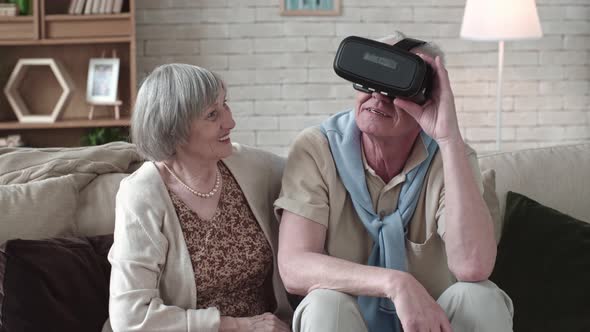 Amazed Elderly Man in VR Headset alt