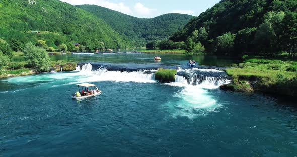 Aerial view of a boat sailing the Una River, Croatia. alt