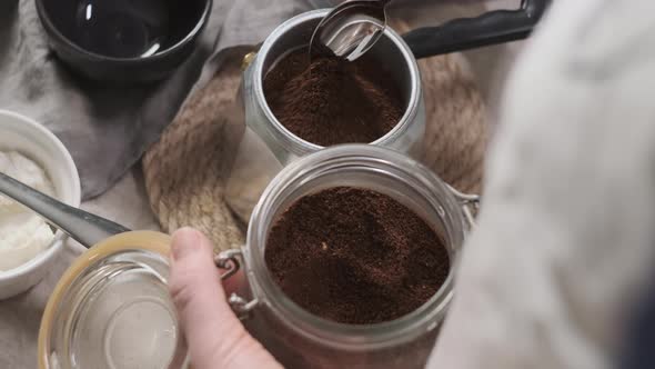 Rack Focus Hand Held Footage Woman or Girl in Beige Apron Serves Table at Home or in Restaurant and alt