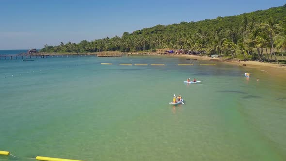 Aerial View Over Tourist Kayaking in a Tropical Resort on Summer alt