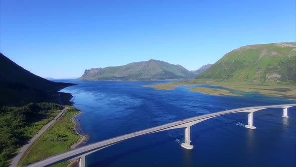 Flying by amazing bridge on Lofoten islands in Norway