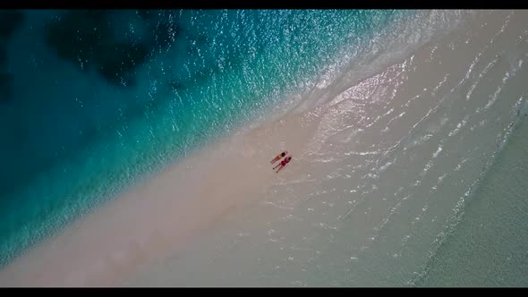 Romantic couple posing on luxury sea view beach wildlife by transparent water and white sand backgro alt