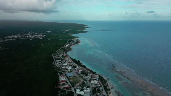Aerial landing of the beach of Mahahual in Mexico alt