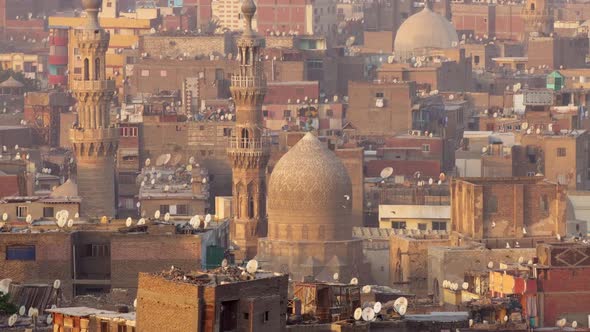 Zoom Out Shot of Islamic Quarter of Cairo with Houses and Mosques alt