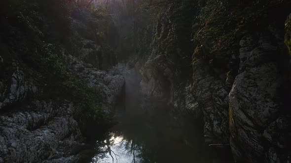 Flying Over a River Through a Narrow Canyon with White Rocks Sochi alt