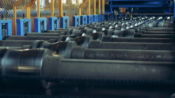 Rollers of a Factory Equipment Are Spinning at Intervals alt