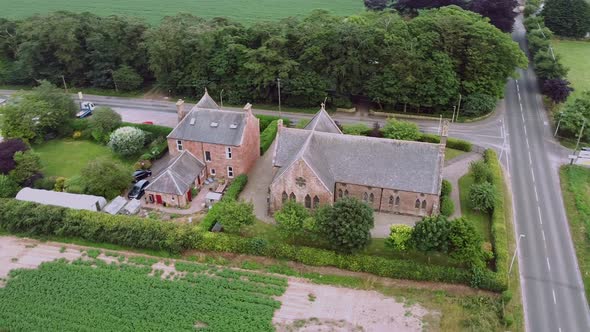 Beautiful Drone View of a Small Village Among the Fields of Scotland