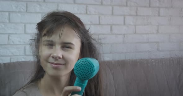 Fashion time with a hairdryer.  alt