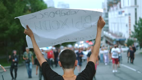 Revolt Activist Marching Before Resistance People Crowd Holding Banners Placard