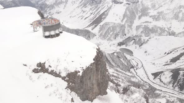 Gudauri, Georgia - April 17, 2021: Aerial view of Russia–Georgia Friendship Monument alt