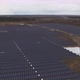 Aerial View Over a Solar Farm On a Winter Day the Grass is Brown Beneath the Panels - VideoHive Item for Sale