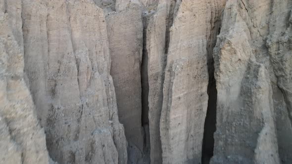 A drone flies toward the unique rocky desert formations of Afton Canyon in the Mojave Desert of Cali alt