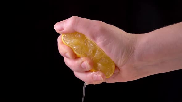 Slowmotion Lemon. The Hand Squeezes of Lemon Juice