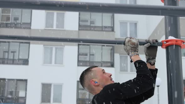 Man training outdoors on sports field in winter