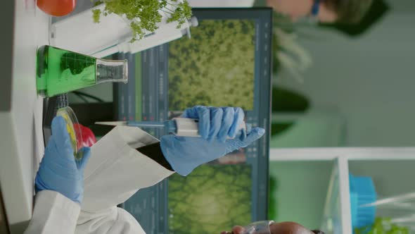 Vertical Video Biologist Scientist African Woman Researcher Taking Genetic Solution From Test Tube alt