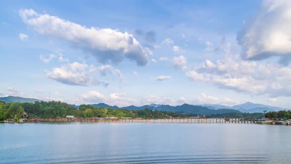 Mon Bridge, longest wooden bridge in Sangkhlaburi, sunny day, Kanchanaburi, Thailand - Time Lapse