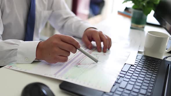 Businessmen Use Computers To Trade Stocks And Analyze Market Data