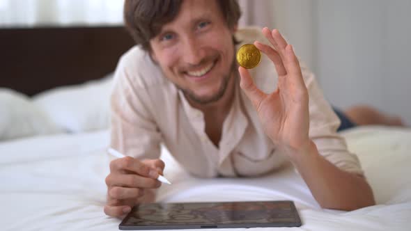 A Man Digital Artist Contemporary Painter Hold an NFT Coin in His Hand alt