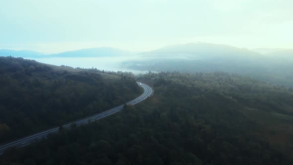 Busy speedy highway road through mountain pass.  alt